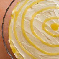 Top of No-Bake Lemon Cheesecake swirled with lemon curd