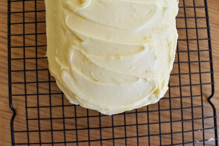 Close up of iced earl grey cake on wire rack.