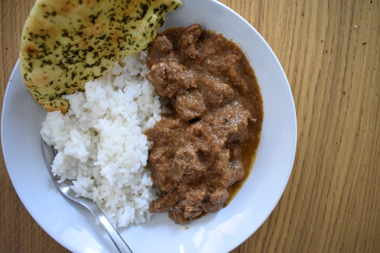 served lamb curry in bowl