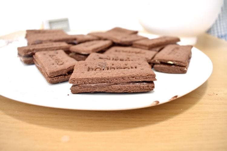 side view of chocolate bourbons on a plate