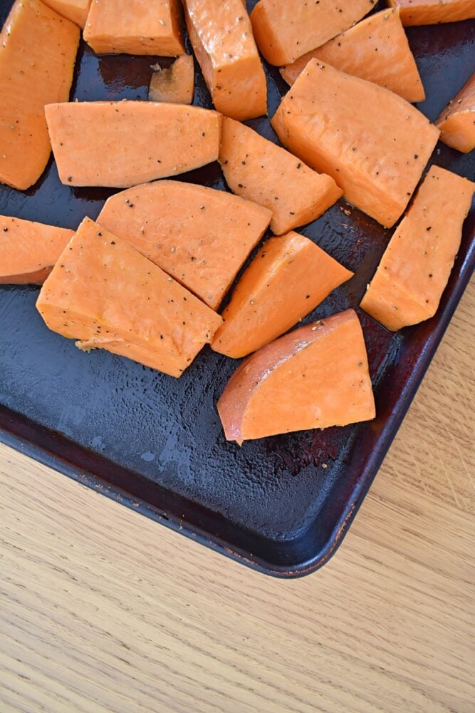 uncooked wedges of baking tray