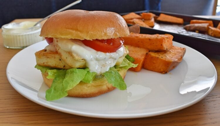 Close up of burger showing garlic sauce