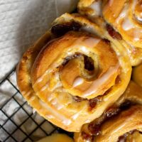 Top view, close up of mince pie cinnamon roll on wire rack
