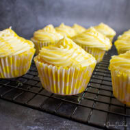 Lemon Cupcakes with lemon buttercream on wire rack