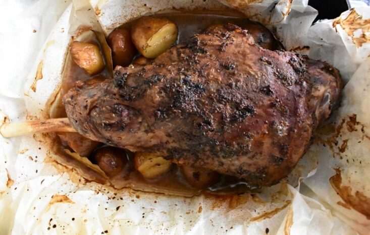 cooked lamb kleftiko and potatoes.