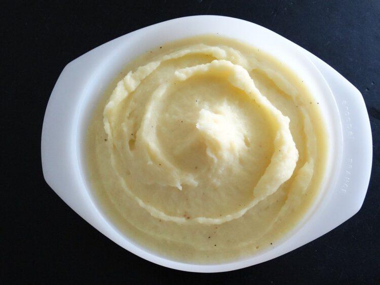 mashed potatoes in small white bowl.