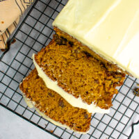 Sliced Carrot Cake on wire rack.