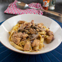 side view of served pasta and stroganoff.