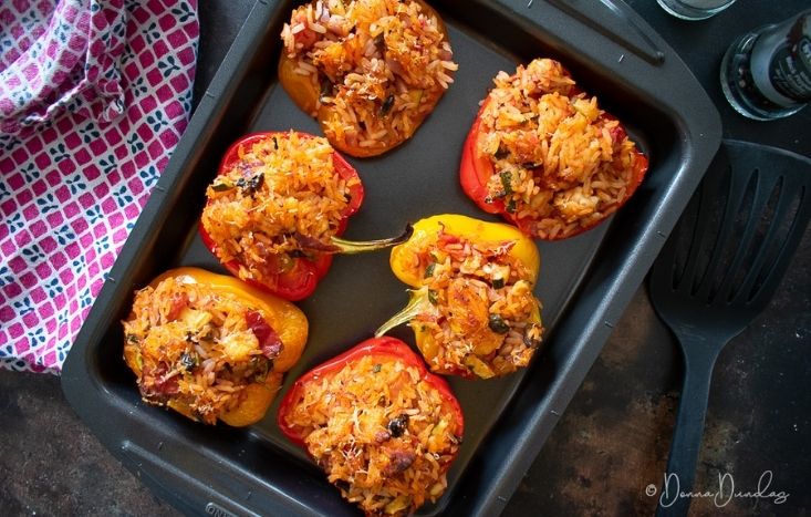Halloumi Stuffed Peppers in baking tray.