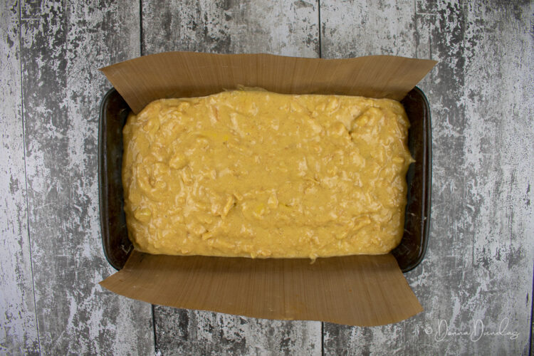 cake mix in loaf tin with baking paper.