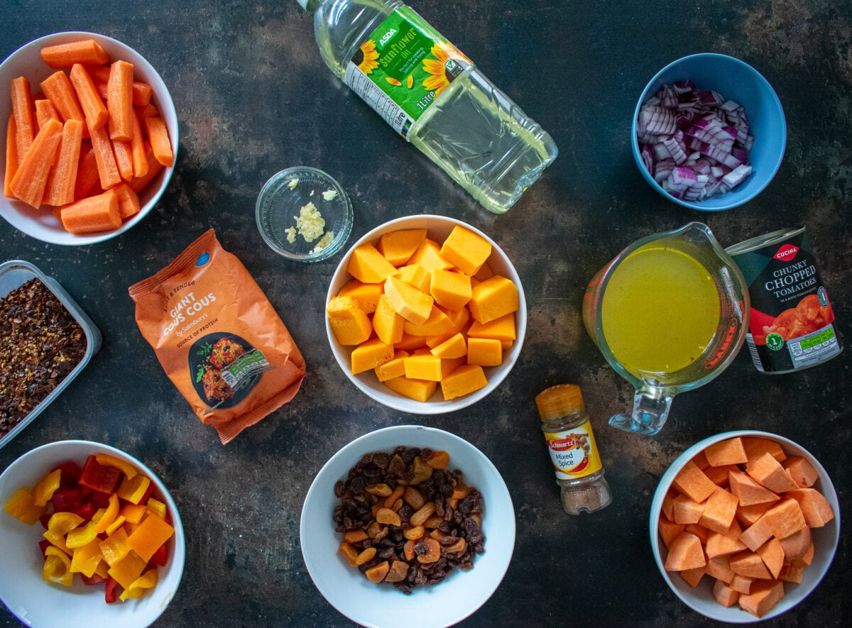 ingredients for vegetable tagine in bowls on table.