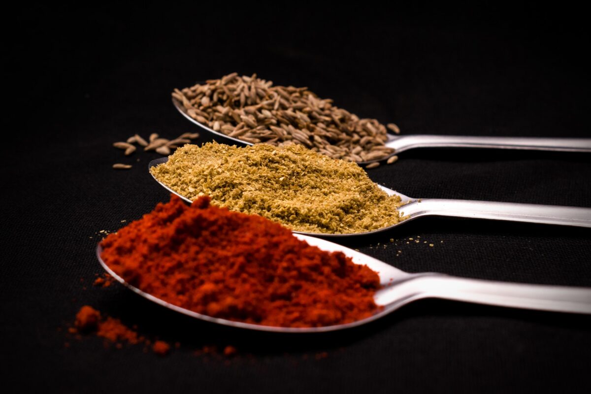 Substitutes for Curry Powder - photo of different spices on spoons.