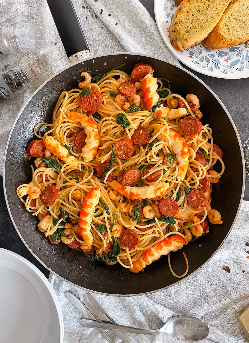 prawn and chorizo pasta in frying pan from above.