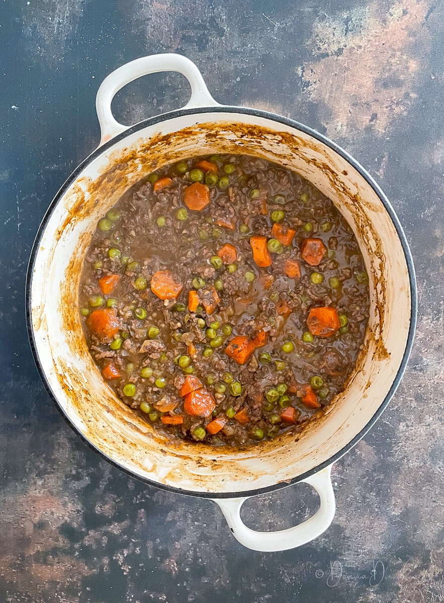 cottage pie filling in white cast iron dish.