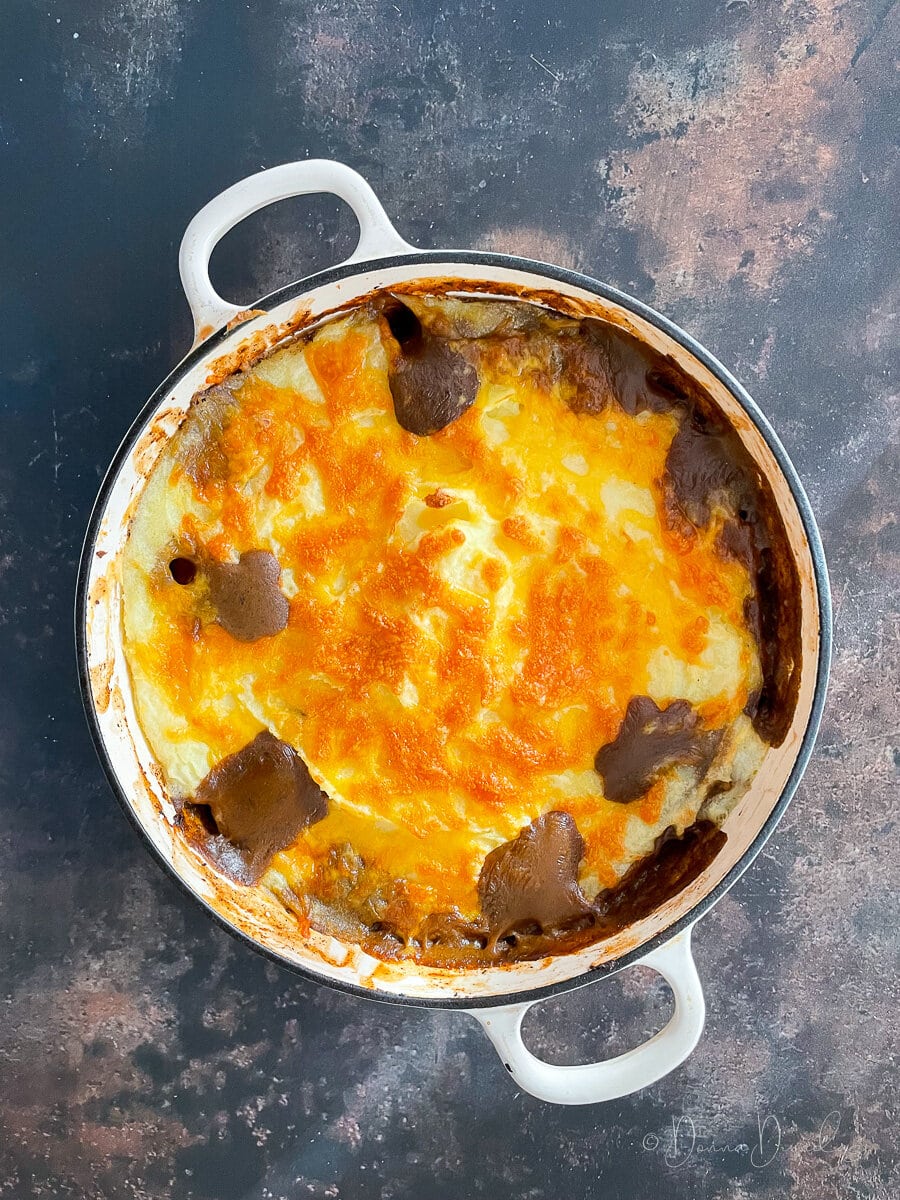 baked haggis cottage pie in cast iron dish.