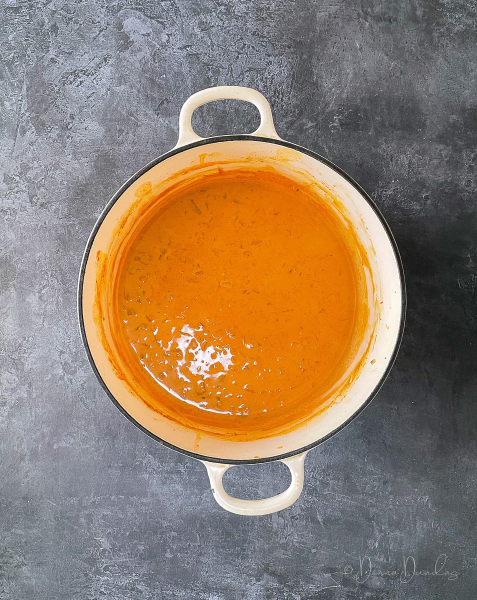 tomato based pasta sauce in cast iron dish.