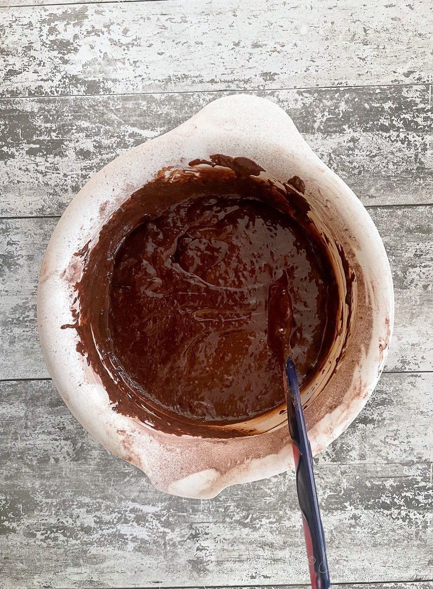 brownie mix in large white mixing bowl.
