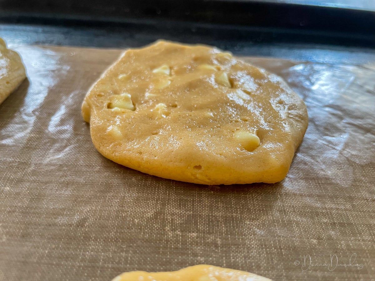 close up, side view of unbaked cookie on baking tray.