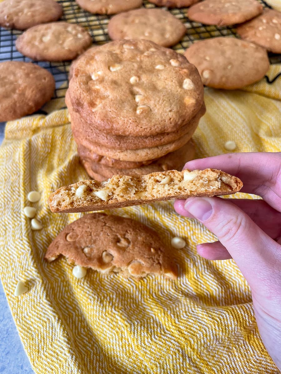 cookie broken in half, chocolate chips visible in middle.