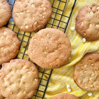 white chocolate chip cookies on wire rack.