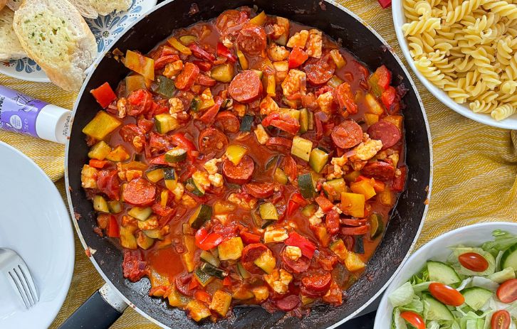 Halloumi and Chorizo Pasta in tomato sauce in frying pan.