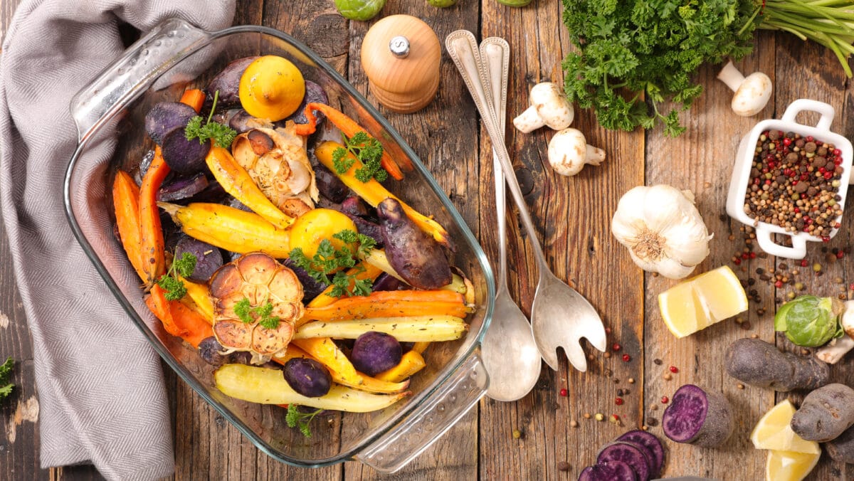 roasted vegetables in glass cooking dish.