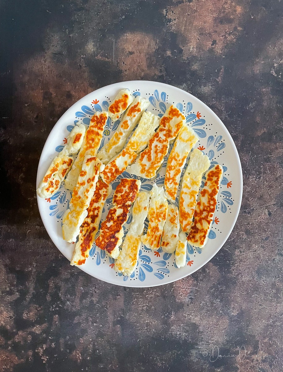 fingers of halloumi on plate.