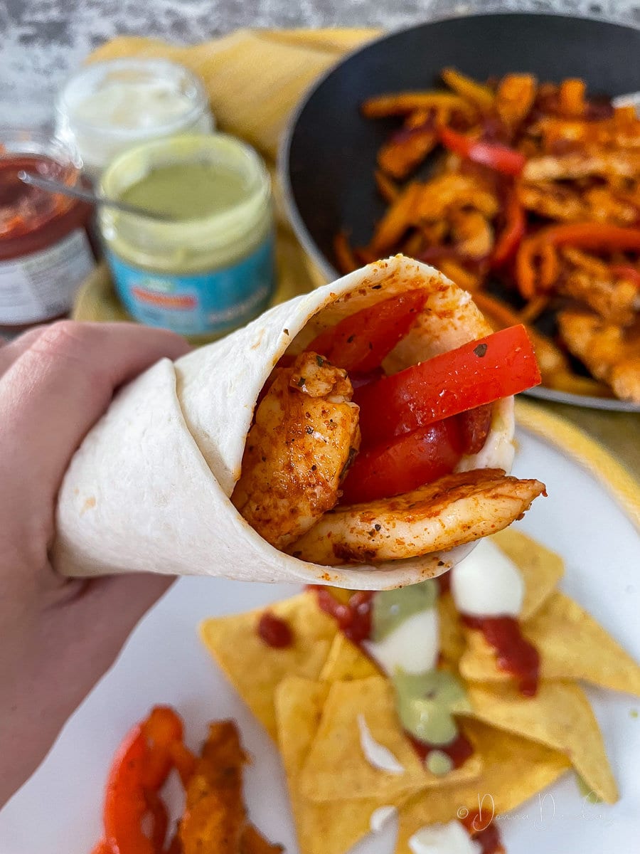 halloumi fajita held up to camera.