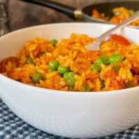 chorizo fried rice in bowl with fork.