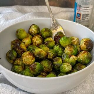 Air Fryer Brussels sprouts are soft in the middle, but a little crispy at the edges, a bit nutty, and absolutely delicious. Air frying sprouts is so quick and easy and a great way to make room on your hob!