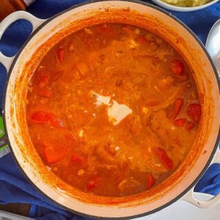 Chicken Goulash with Soured Cream in a large cast iron cooking dish.