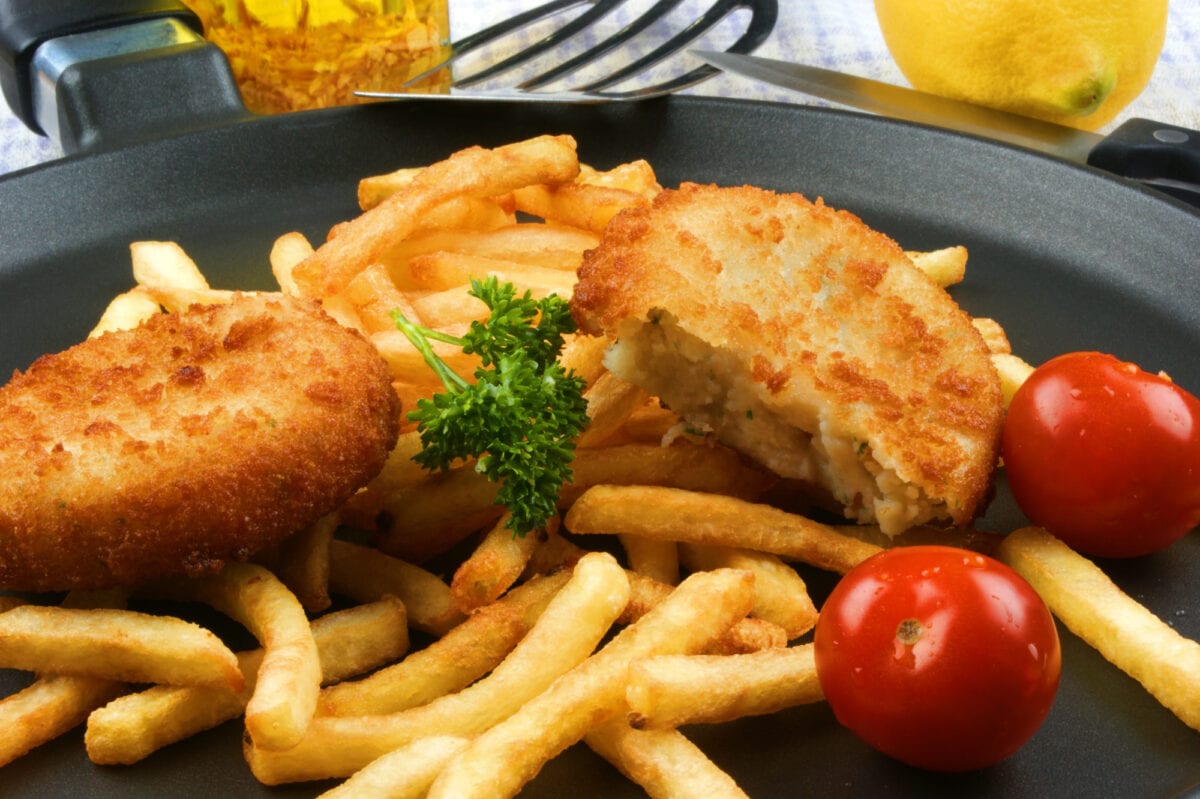 Fish Burger with fried chips on a plate.