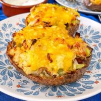 Air Fryer Loaded Potato Skins with Bacon and Leeks, topped with cheese, are incredible! Cheesy, tasty and super easy. Perfect with soured cream.