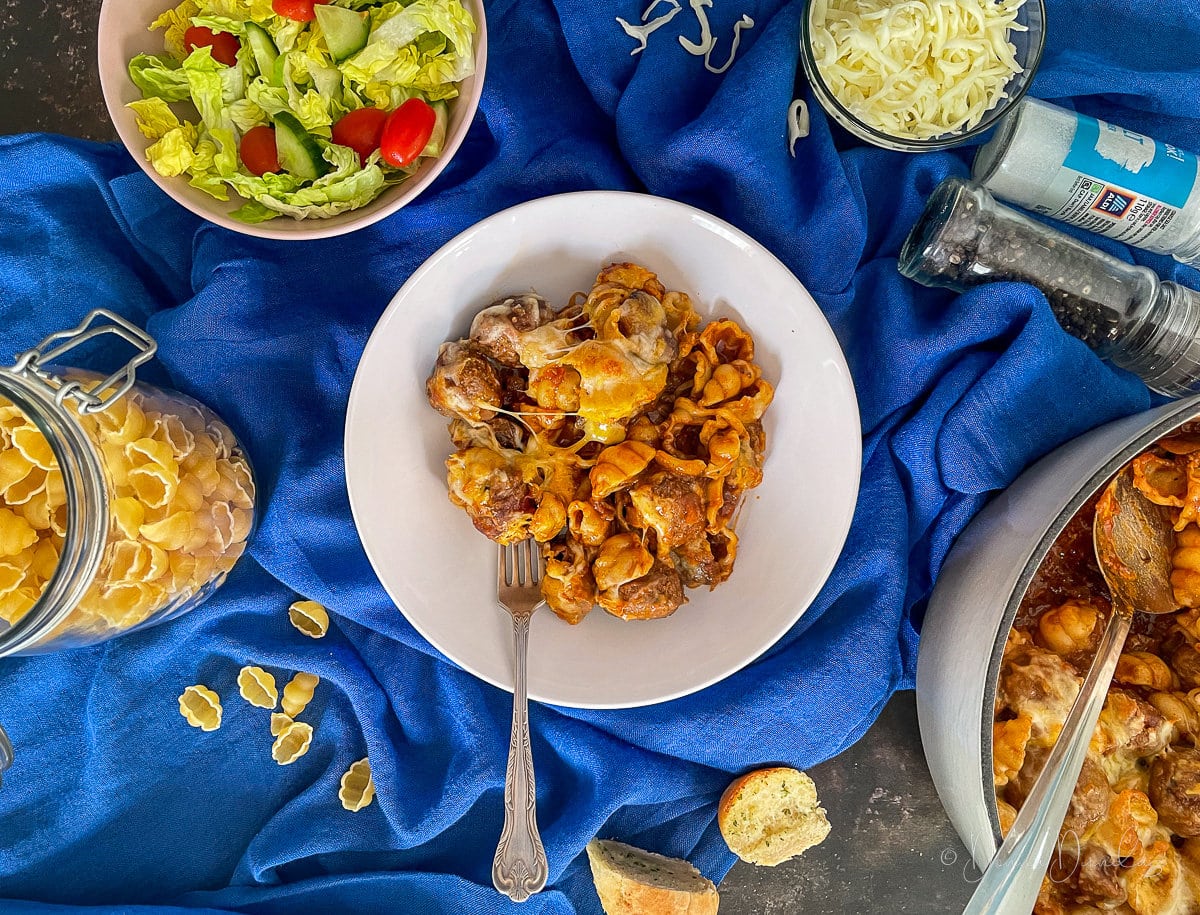 served portion of baked meatball pasta.
