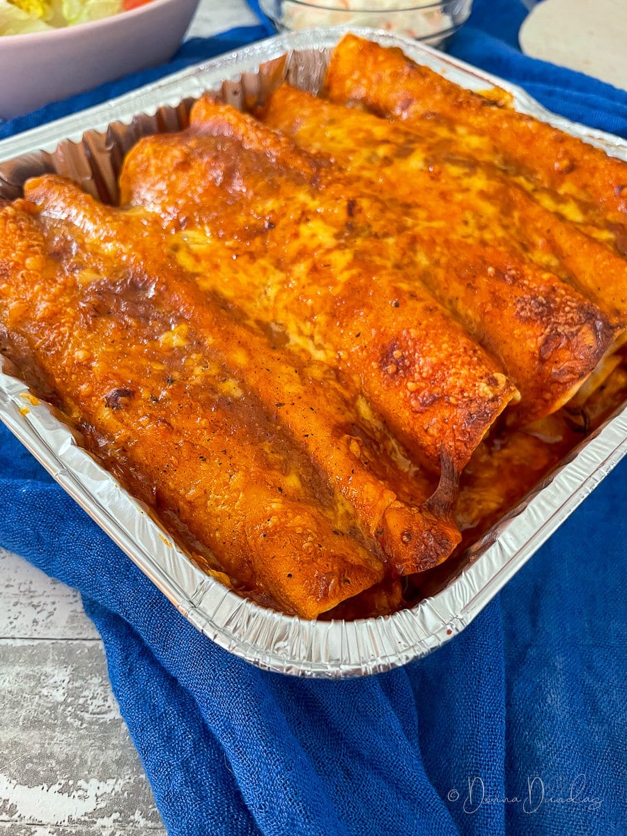 close up of enchiladas in tray.