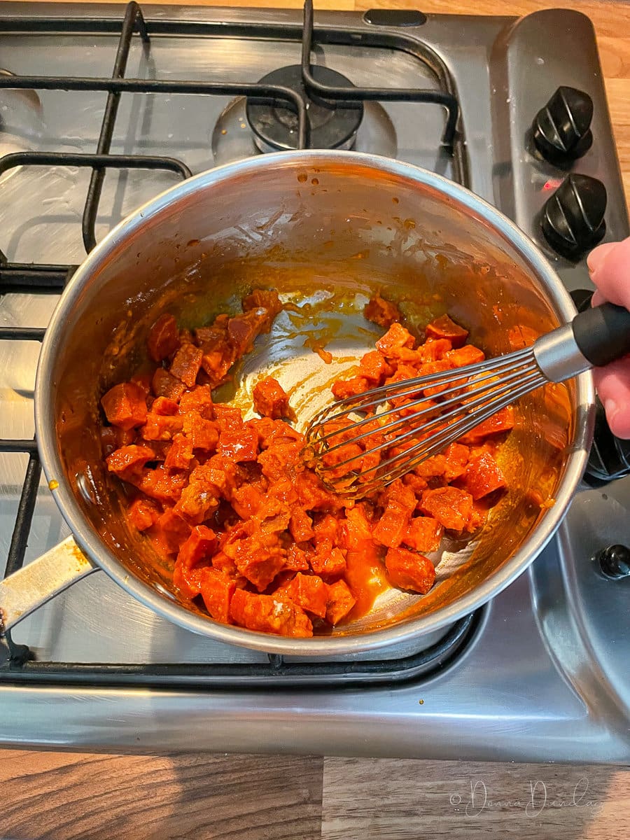 butter and chorizo mixed with flour in saucepan.