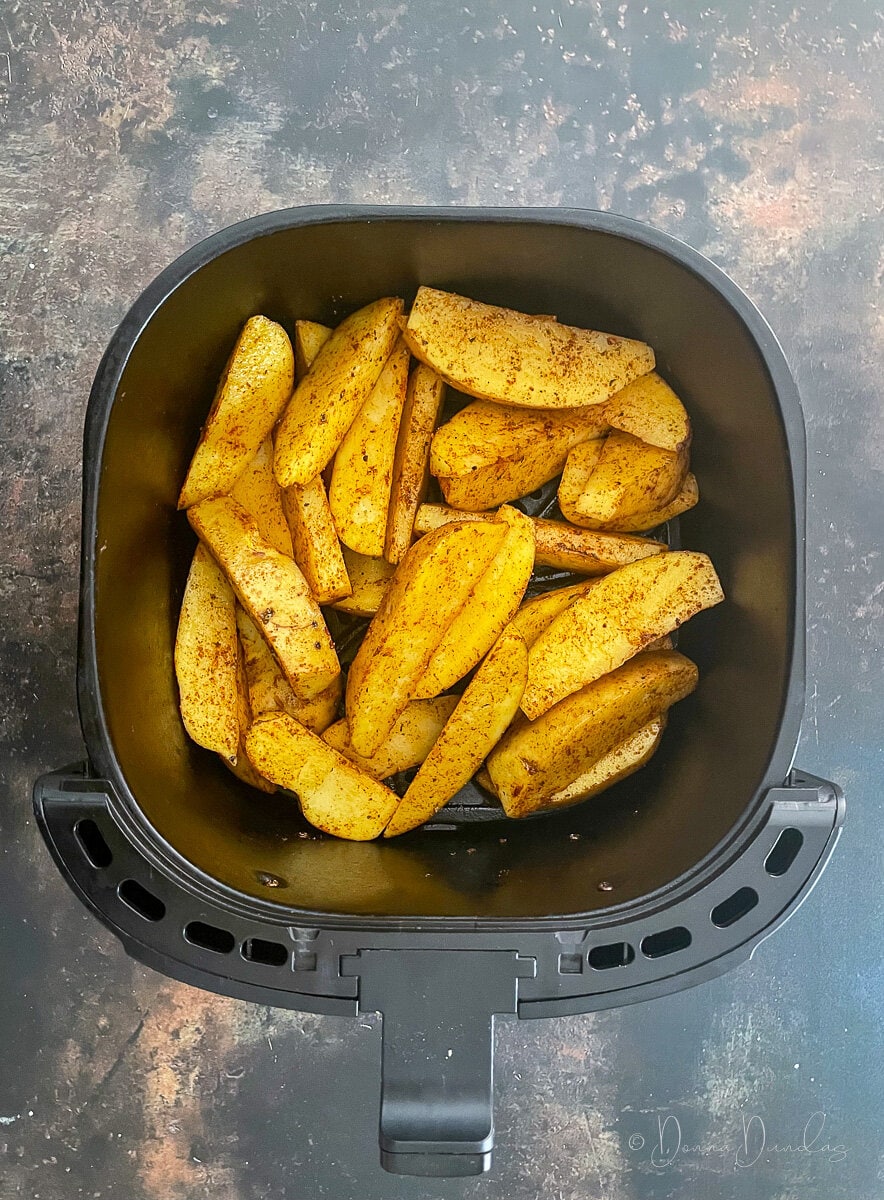 fajita wedges in air fryer basket.