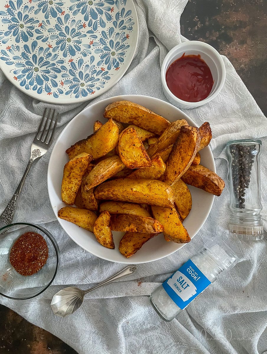 Air Fryer Fajita Potato Wedges in white bowl.
