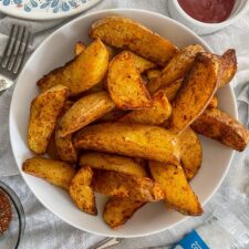 Air Fryer Fajita Potato Wedges in white bowl.