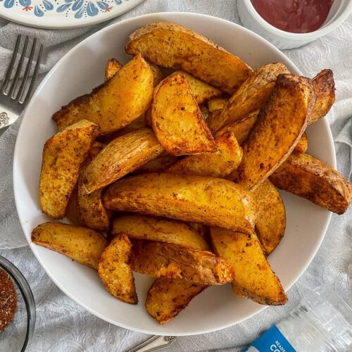 Air Fryer Fajita Potato Wedges in white bowl.