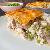 side view of pie with chicken ham and peas.