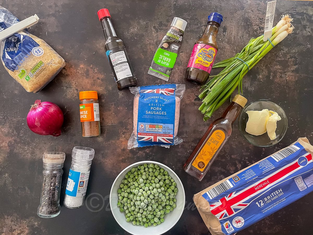 ingredients for sausage fried rice on table.