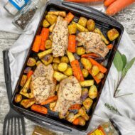 pork chop traybake with root vegetables and a honey and mustard dressing.