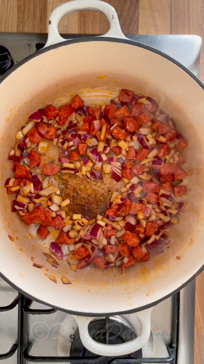 cooked chorizo, onion in dutch oven.