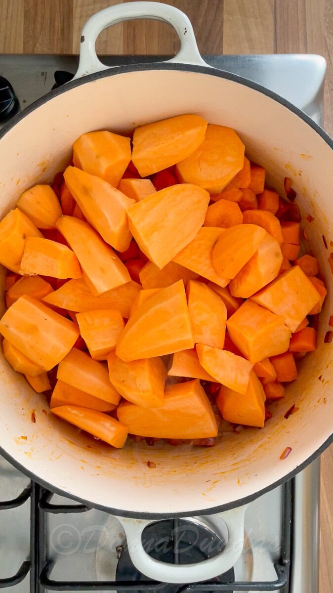 chunks of sweet potato in dutch oven.