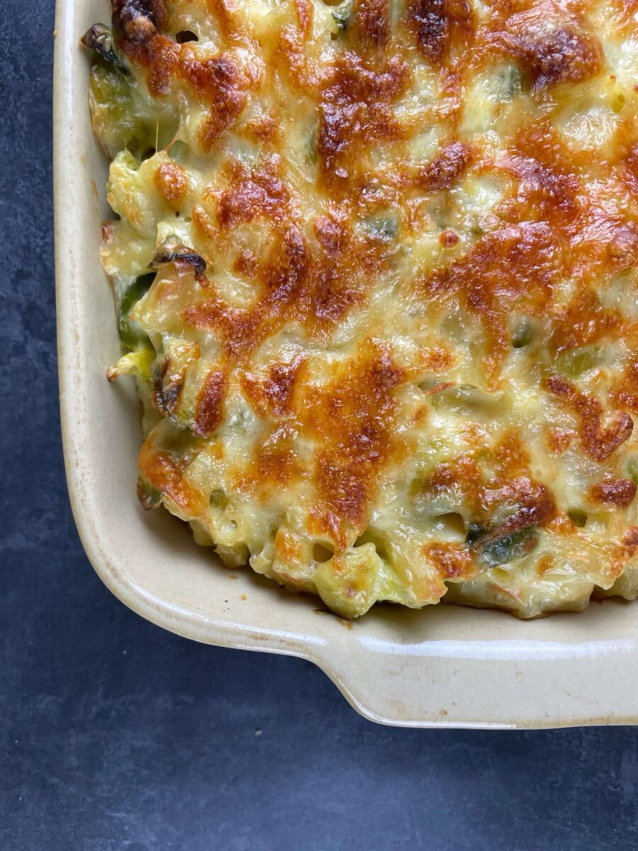 close up of sprouts mac and cheese in baking dish.