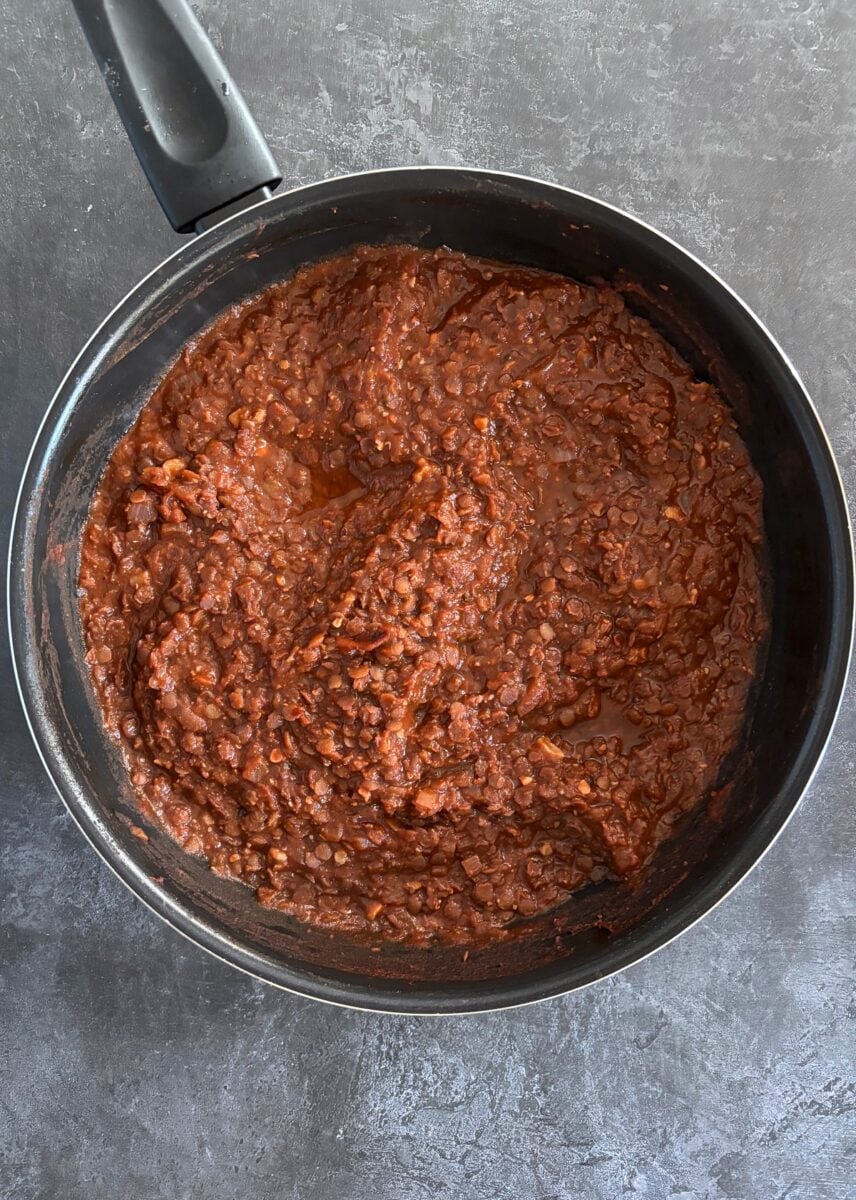 lentil bolognese cooking in frying pan.